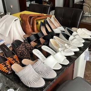 I am selling my size 8 wardrobe of woman’s designer shoes, 13 pair next to new!